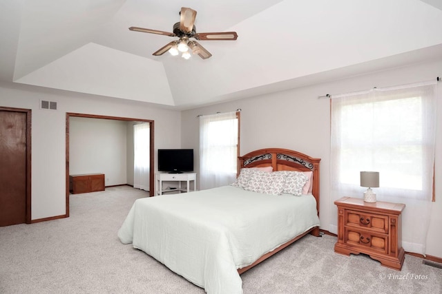 carpeted bedroom featuring ceiling fan and vaulted ceiling