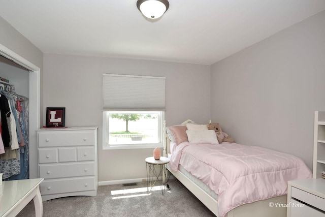 carpeted bedroom with a closet