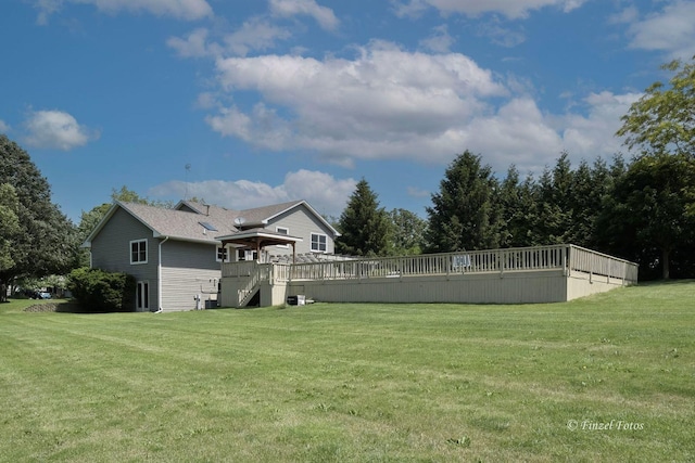 view of yard featuring a wooden deck