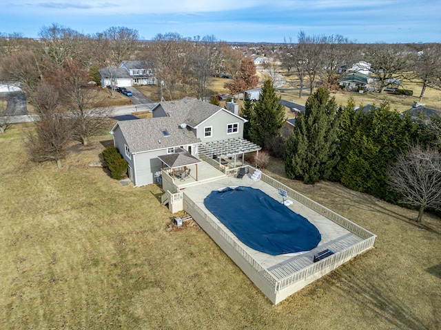 view of swimming pool with a lawn