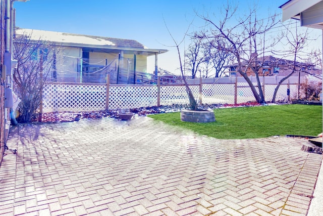 view of front of house featuring a front lawn and a patio