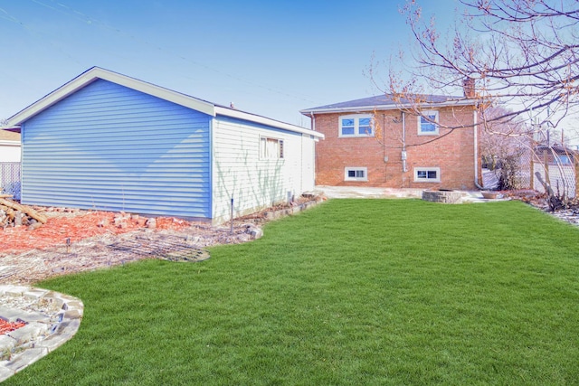 rear view of house with a lawn