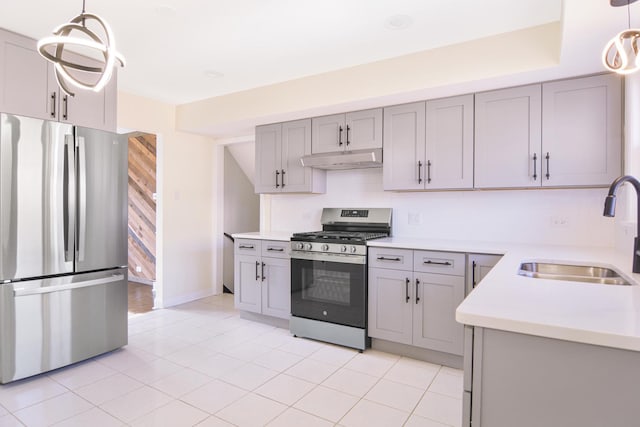 kitchen featuring gray cabinets, appliances with stainless steel finishes, sink, and pendant lighting