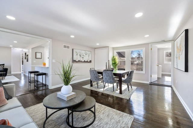 living room featuring dark wood-type flooring