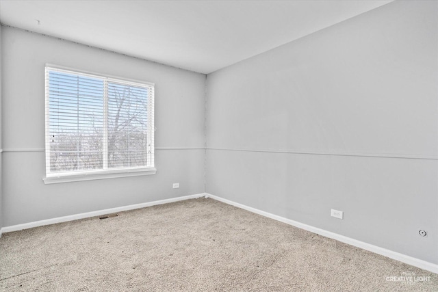 spare room featuring carpet flooring