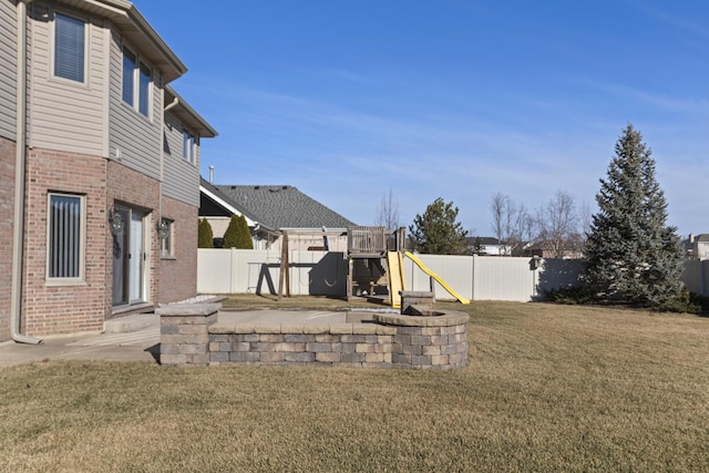 view of yard with a playground and a patio