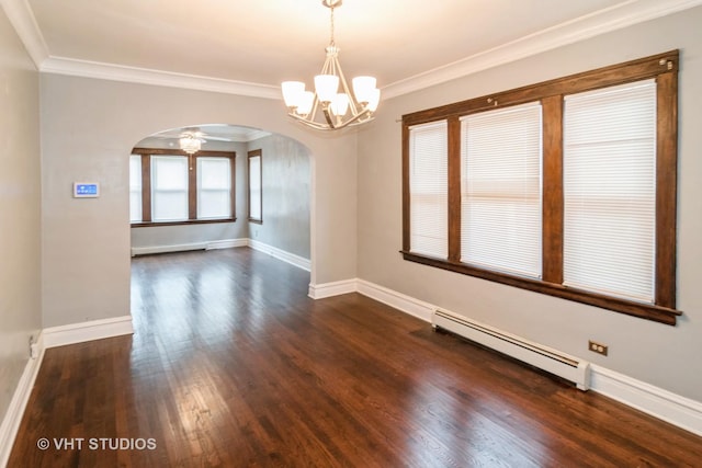 empty room featuring dark wood-type flooring, crown molding, a chandelier, and a baseboard heating unit