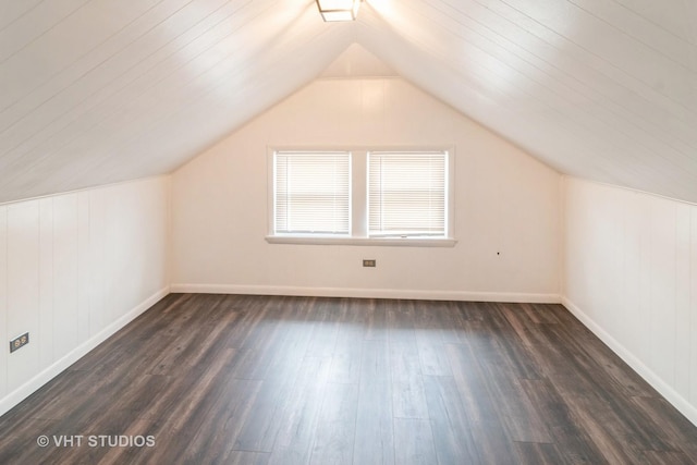 bonus room featuring lofted ceiling and dark hardwood / wood-style floors