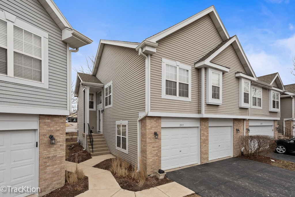 view of side of home with a garage