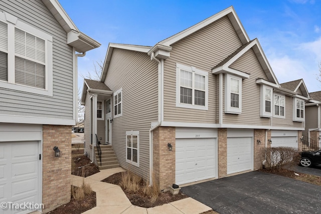 view of side of home with a garage