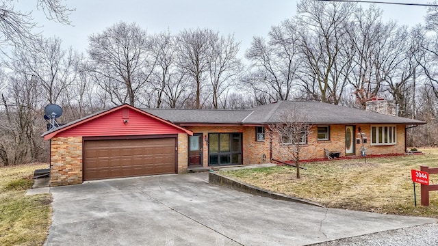 ranch-style home with a garage and a front lawn