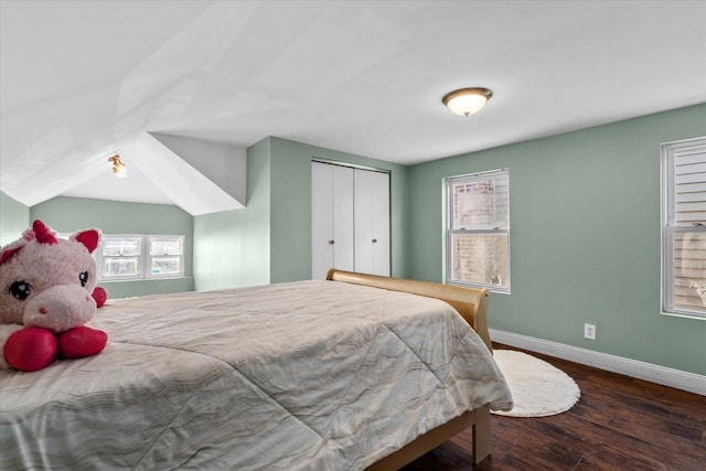 bedroom with dark hardwood / wood-style flooring