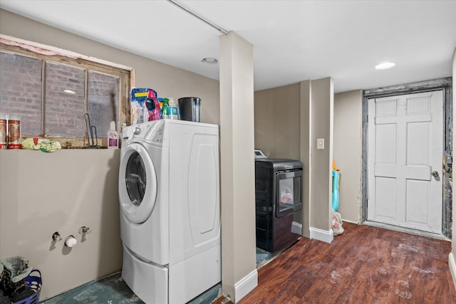 washroom featuring washer / clothes dryer and dark hardwood / wood-style flooring