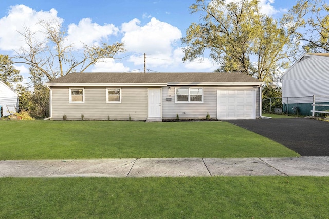 ranch-style home featuring a garage and a front yard