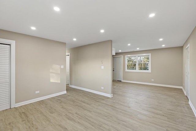 unfurnished room with light wood-type flooring