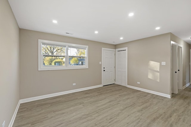 unfurnished room featuring light wood-type flooring