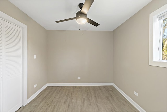 empty room featuring ceiling fan and light hardwood / wood-style floors