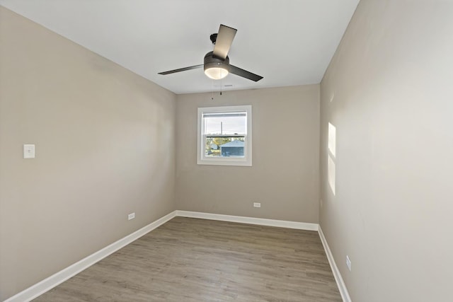 empty room featuring ceiling fan and light wood-type flooring