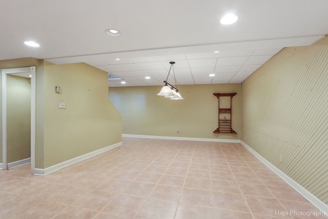 unfurnished room with recessed lighting, a paneled ceiling, baseboards, and light tile patterned floors