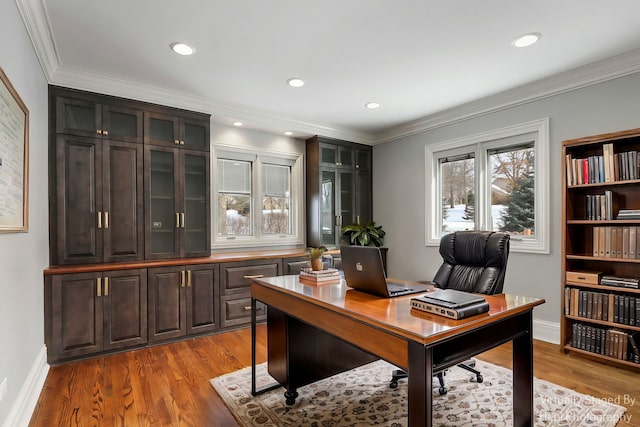 office featuring light wood-style flooring, ornamental molding, and recessed lighting