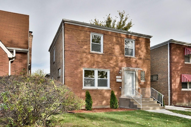 view of front of house with a front lawn