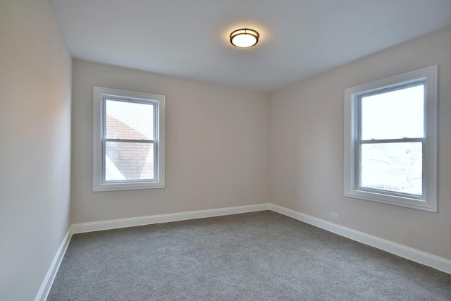 unfurnished room with carpet flooring