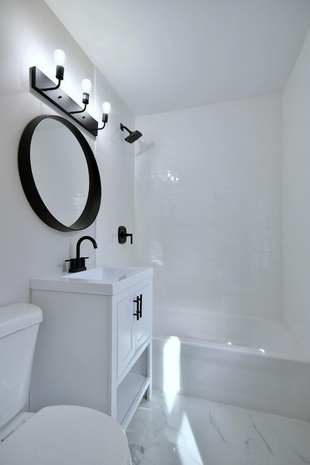 full bathroom featuring vanity, toilet, and tiled shower / bath combo