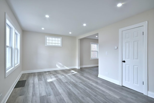 spare room featuring hardwood / wood-style flooring