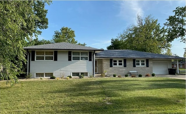 split level home featuring a garage and a front yard