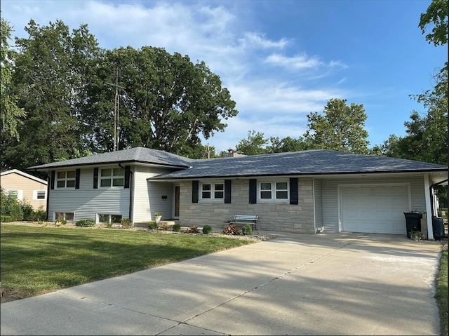 view of front of house with a garage, stone siding, concrete driveway, and a front yard