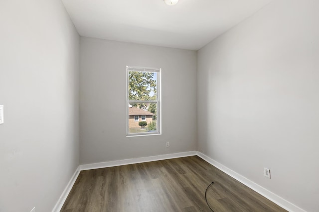 unfurnished room featuring dark hardwood / wood-style floors