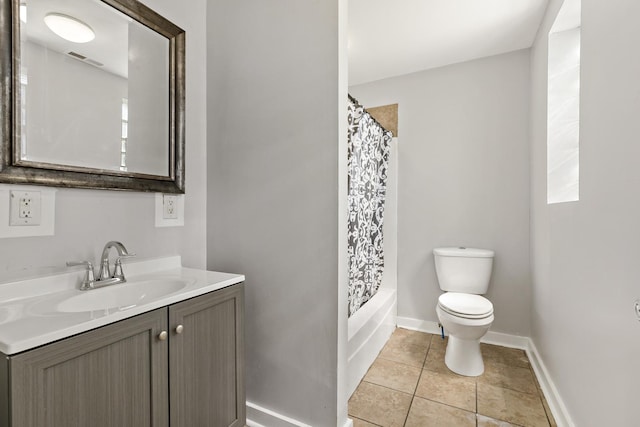 full bathroom with vanity, shower / bath combination with curtain, tile patterned floors, and toilet