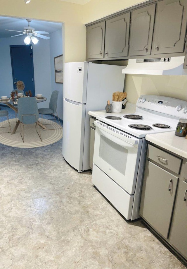 kitchen featuring white appliances, gray cabinets, and ceiling fan