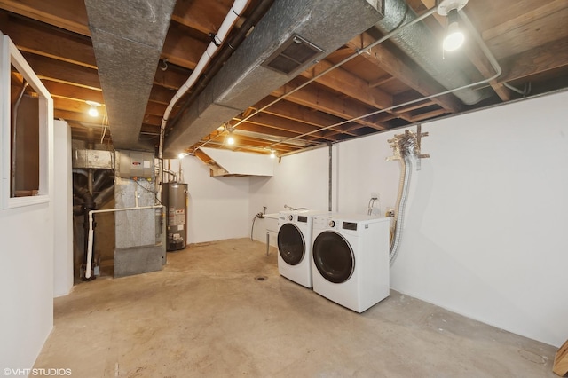 basement with washer and dryer and water heater