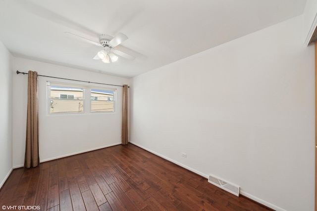 unfurnished room with ceiling fan and dark hardwood / wood-style flooring