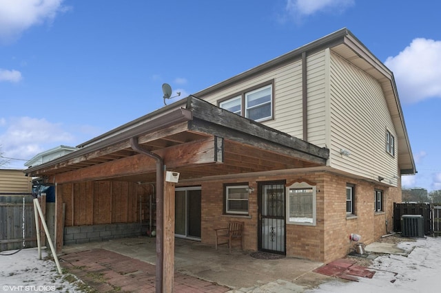 back of property featuring central AC unit and a patio area