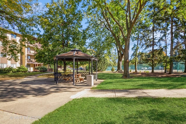 surrounding community featuring a gazebo and a yard