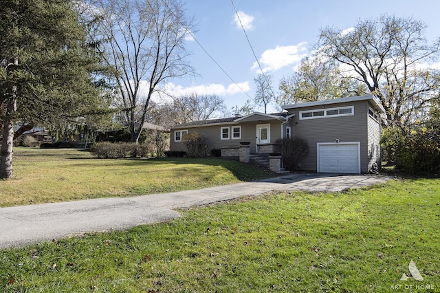 view of front of house with a garage and a front yard