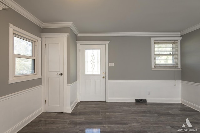 foyer featuring crown molding and dark hardwood / wood-style floors