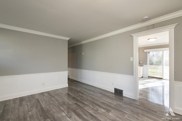 unfurnished room with dark hardwood / wood-style flooring and ornamental molding