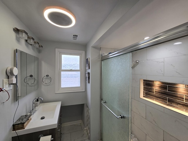 bathroom featuring vanity and walk in shower