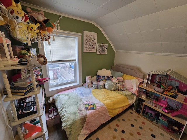 bedroom featuring crown molding and lofted ceiling