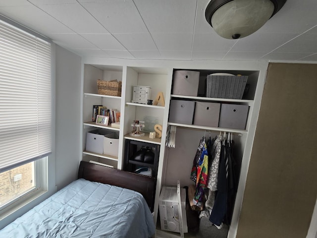 bedroom with a wall unit AC