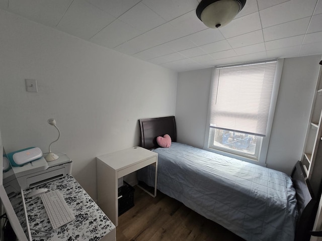 bedroom featuring dark wood-type flooring