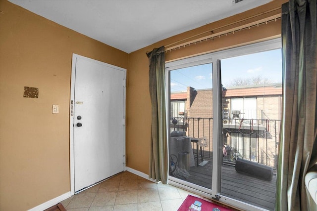 doorway featuring light tile patterned flooring