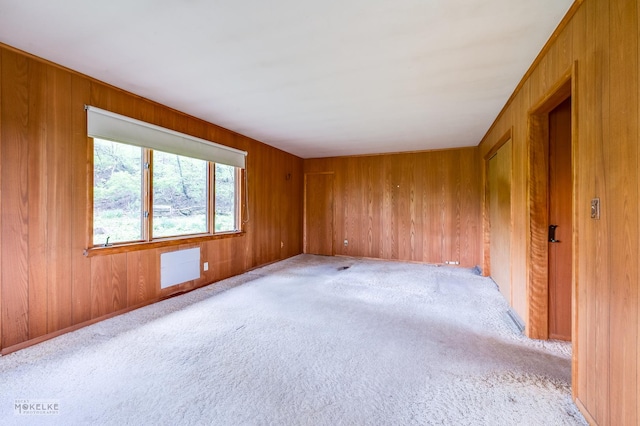 1026 State Route 25, Oswego, IL 60543 - spare room featuring light carpet and wood walls