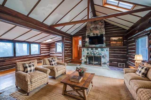 1026 State Route 25, Oswego, IL 60543 - living room with log walls, a fireplace, lofted ceiling with skylight, and wood finished floors
