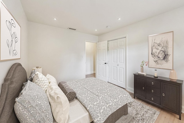 bedroom featuring a closet and light wood-type flooring