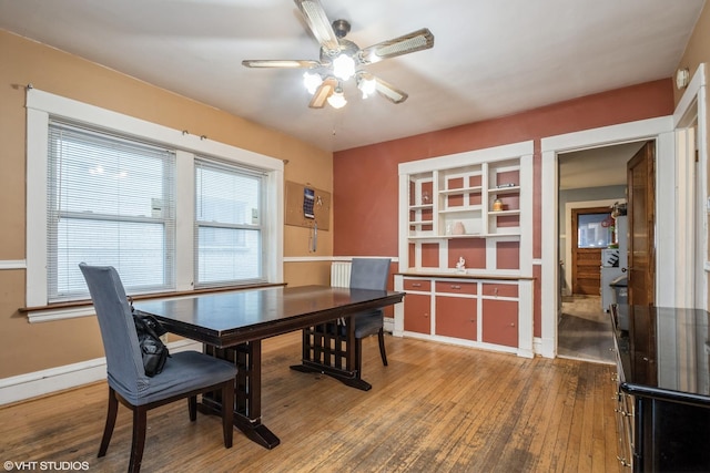 dining space featuring hardwood / wood-style floors and ceiling fan