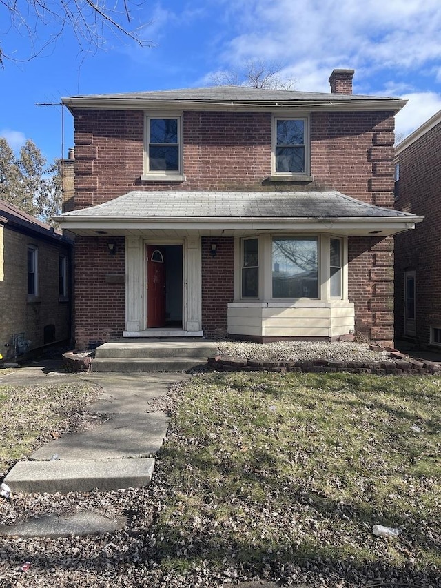 front facade featuring a front yard